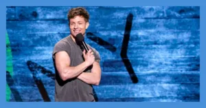 Matt Rife, a man from Wild 'N Out show, holds a microphone and smiles confidently